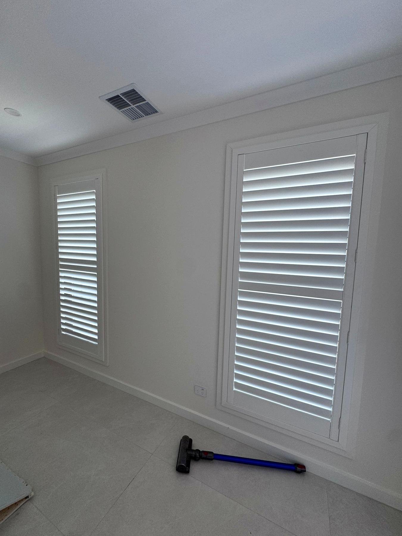 White plantation shutters with open louvres