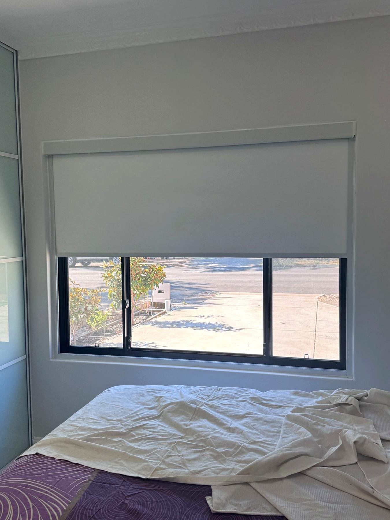 Blockout roller blind with headbox on a bedroom window